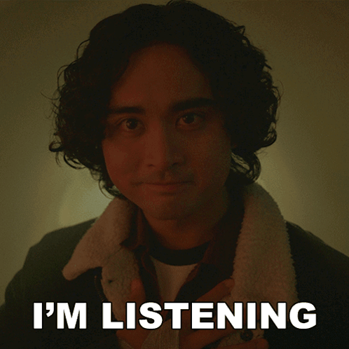 a picture of a man with the words " i 'm listening " behind him