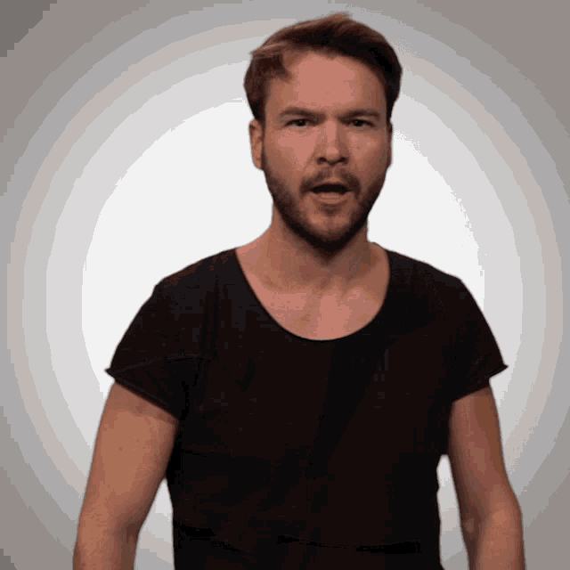 a man with a beard wearing a black shirt