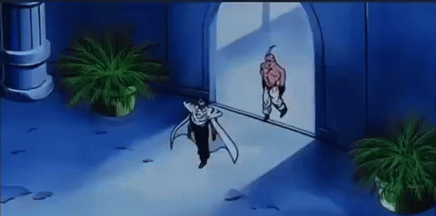 a couple of people standing in a room with plants