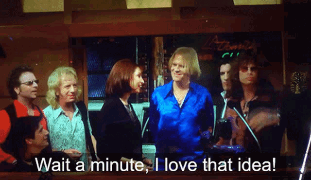 a group of people standing next to each other with the words wait a minute i love that idea