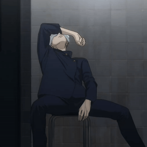 Nanami from Jujutsu Kaisen slumps in a chair with his arm over his face.