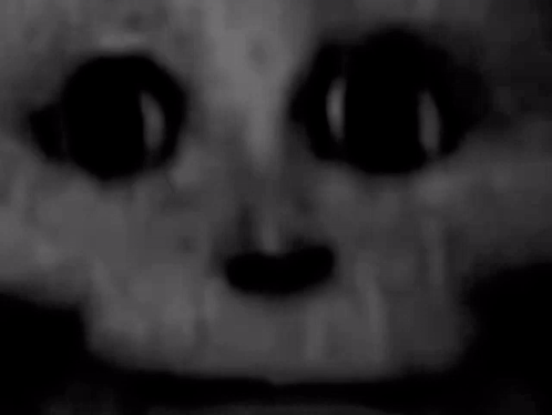 a close up of a person 's face with glowing eyes .