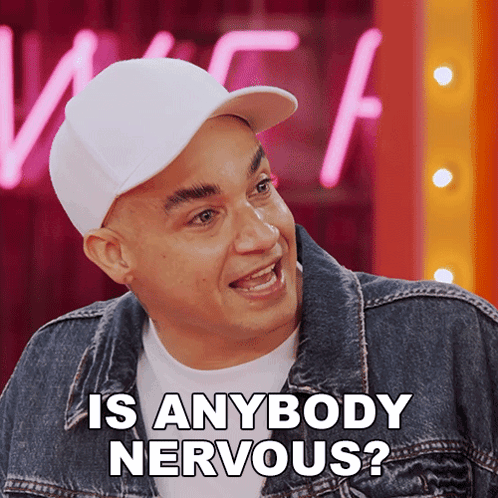 a man wearing a white hat and a denim jacket is asking if anyone is nervous