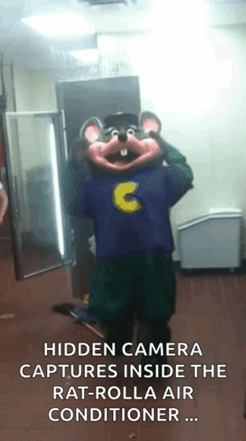 a chuck e cheese mascot is standing in a room with a hidden camera