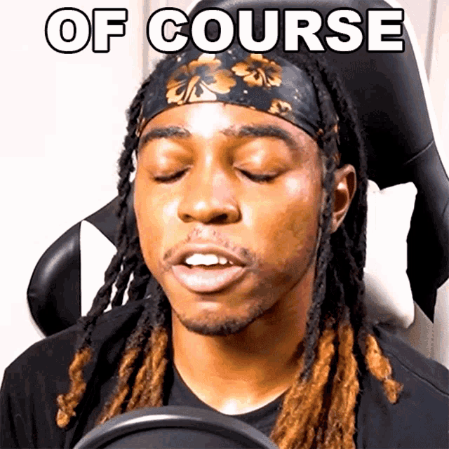 a man with dreadlocks is wearing a headband and the words of course are above him