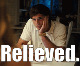 a man is sitting at a table with his hand on his face and the word relieved is written above him
