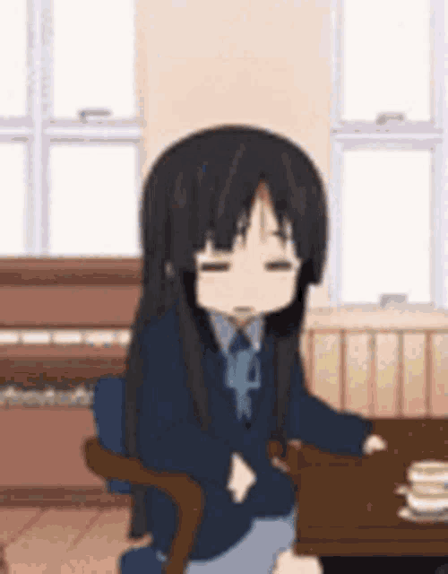 An anime schoolgirl sits at a desk looking blankly exhausted.