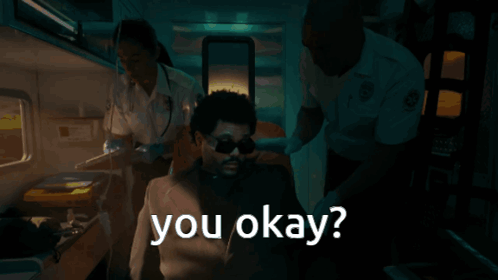 a man in an ambulance with the words " you okay " written on it