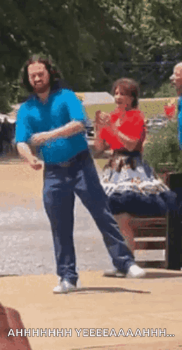 A person in a blue shirt performs a fast clogging step outdoors.