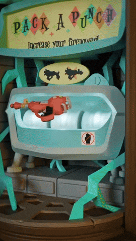 a sign that says pack a punch is above a machine