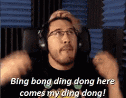 a man with glasses and headphones says bing bong ding dong here comes my ding dong