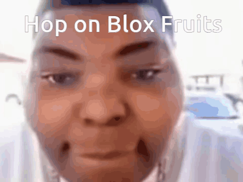 a close up of a person 's face with the words hop on blox fruits above it
