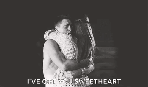 A couple embrace in a black-and-white scene captioned “I’VE GOT YOU SWEETHEART.”
