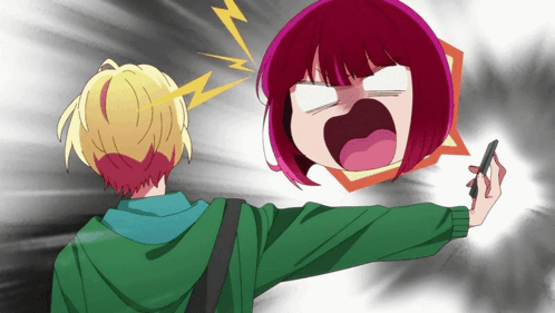 An anime girl shouts at a boy holding a smartphone.