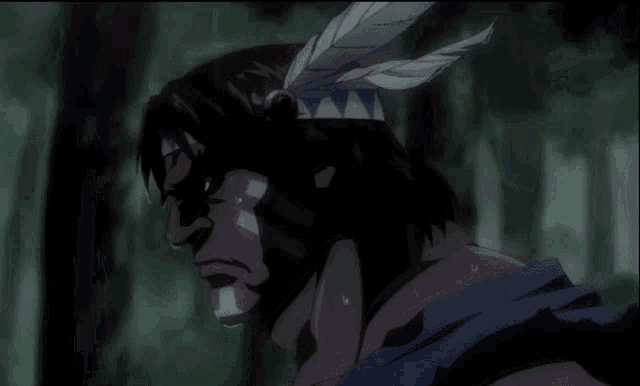 a man with a feather on his head is sweating in a forest