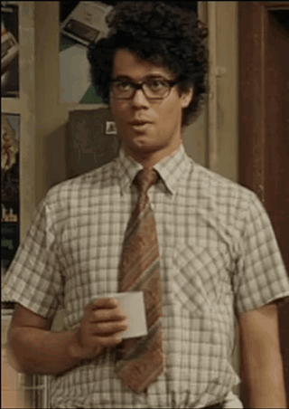 a man in a plaid shirt and tie is holding a white cup