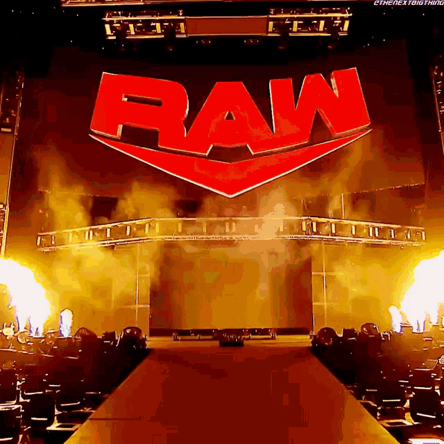 the raw logo is on a large screen in a stadium