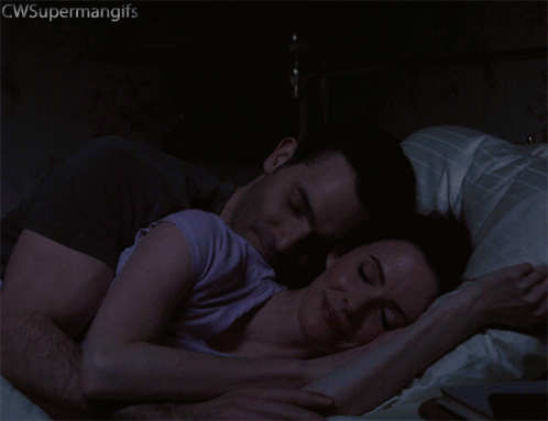 a gif of a man and woman hugging with the words cwsupermangifs above them
