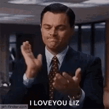 Leonardo DiCaprio claps with the caption “I LOVE YOU LIZ.”