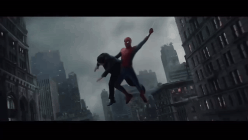 a man in a spiderman costume is flying over a city