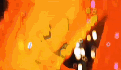 a close up of a person 's face with confetti falling from it