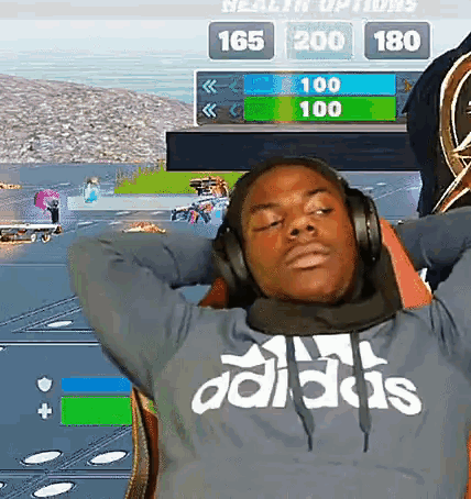 a man wearing headphones and a blue adidas sweatshirt