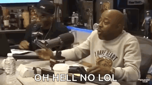 Two men at a radio studio laugh as a caption says “OH HELL NO LOL.”