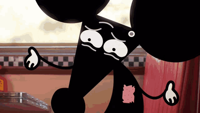 a black cartoon mouse with a pig patch on its chest