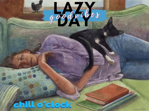 A black cat lies on a person’s chest over the words “LAZY DAY.”