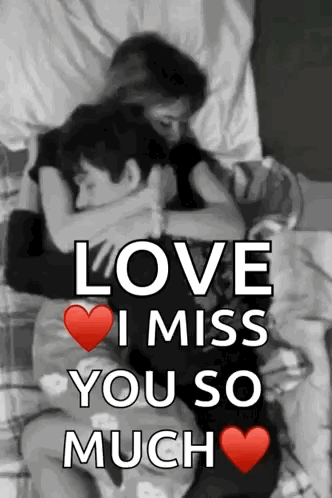 a man and a woman are hugging each other on a bed .