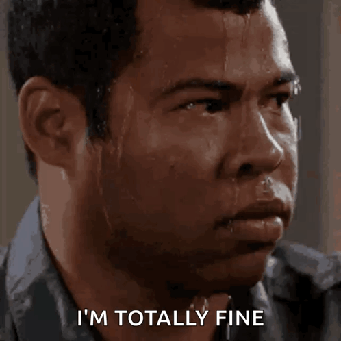 A sweaty man stares ahead with the caption “I'M TOTALLY FINE.”