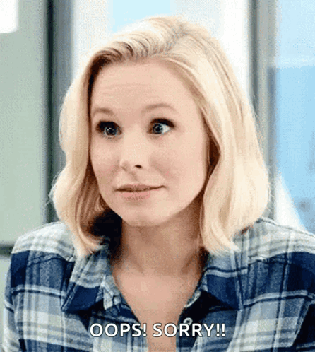 Eleanor from The Good Place gives a small shrug with “OOPS SORRY!” on screen.