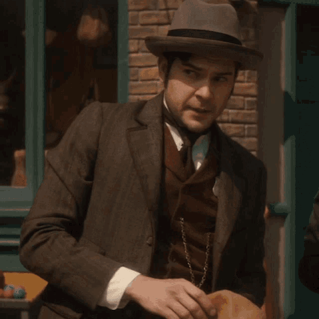a man wearing a suit and hat says i agree with you