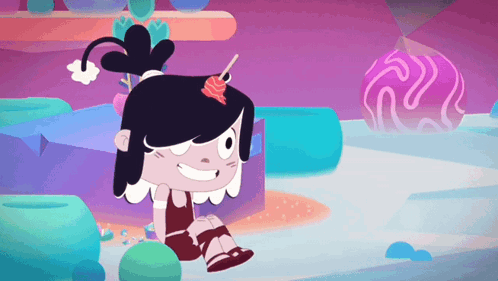 a girl with a lollipop in her hair is smiling