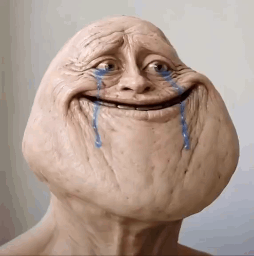 A crying bald meme character smiles awkwardly with blue tears running down its face.