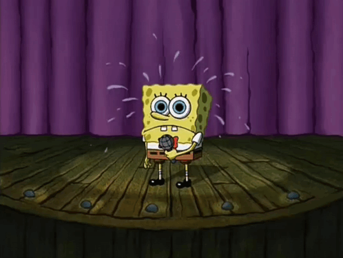 SpongeBob stands alone onstage sweating nervously before purple curtains.