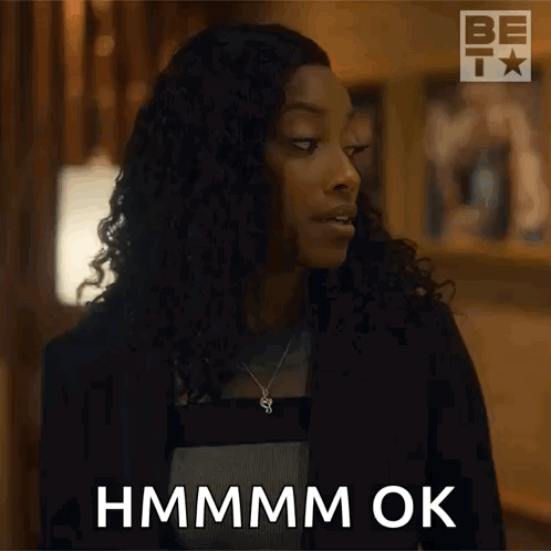 A woman gives a skeptical side glance with “HMMMM OK.” text.