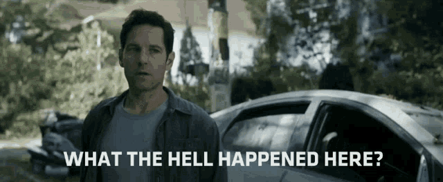 a man standing in front of a car with the words " what the hell happened here " below him