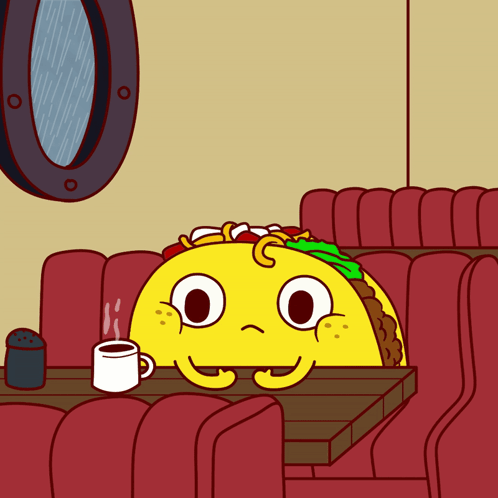 a taco is sitting at a table with a cup of coffee