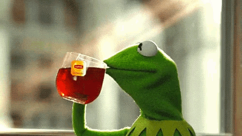 Kermit the Frog sips tea from a Lipton cup.