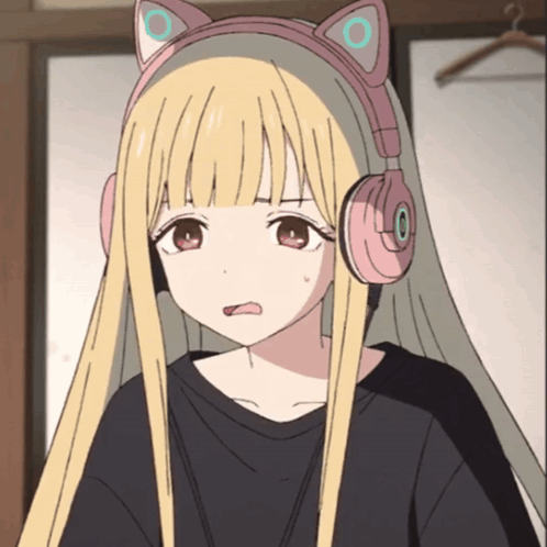 a blonde anime girl wearing headphones with cat ears on her head