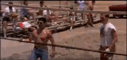 a man without a shirt is playing volleyball on a beach