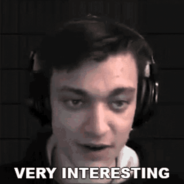 a man wearing headphones says " very interesting "