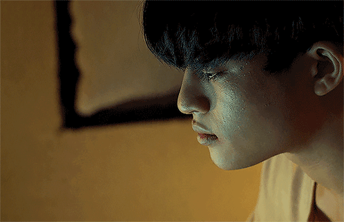 a close up of a person 's face with tears running down their face