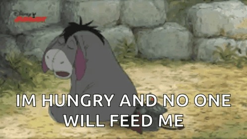 Eeyore sits sadly with “I’M HUNGRY AND NO ONE WILL FEED ME.”