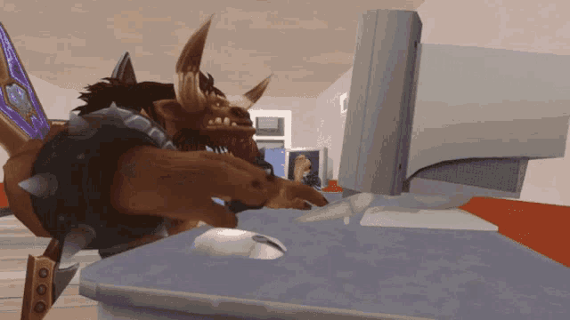 a cartoon character is sitting at a desk looking at a computer screen