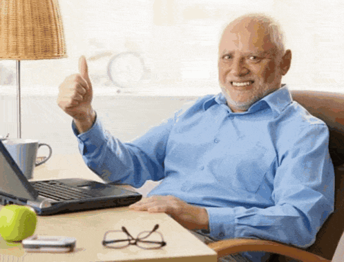 Hide the Pain Harold gives a cheerful thumbs up at a desk.