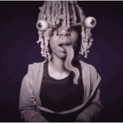a person with dreadlocks and big eyes on their head