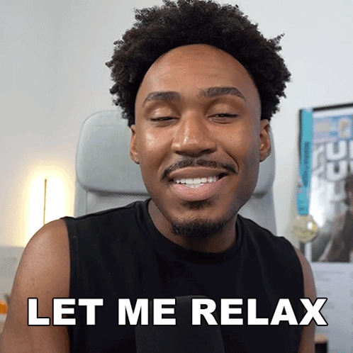 a man sitting in a chair with his eyes closed and the words let me relax above him