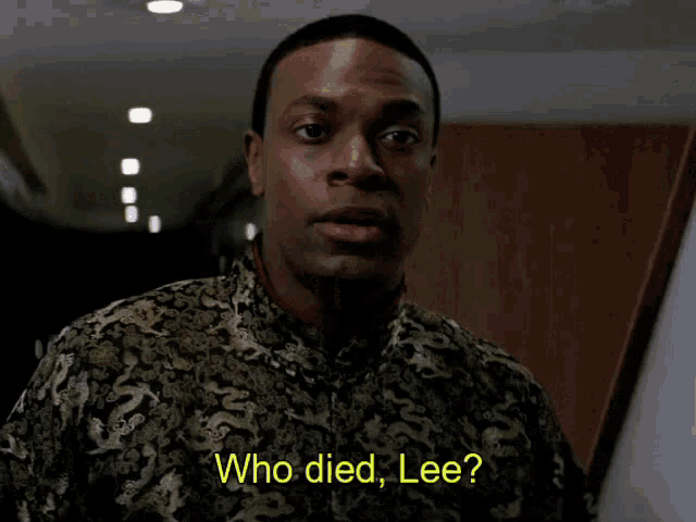 a man in a black and gold shirt is asking who died lee